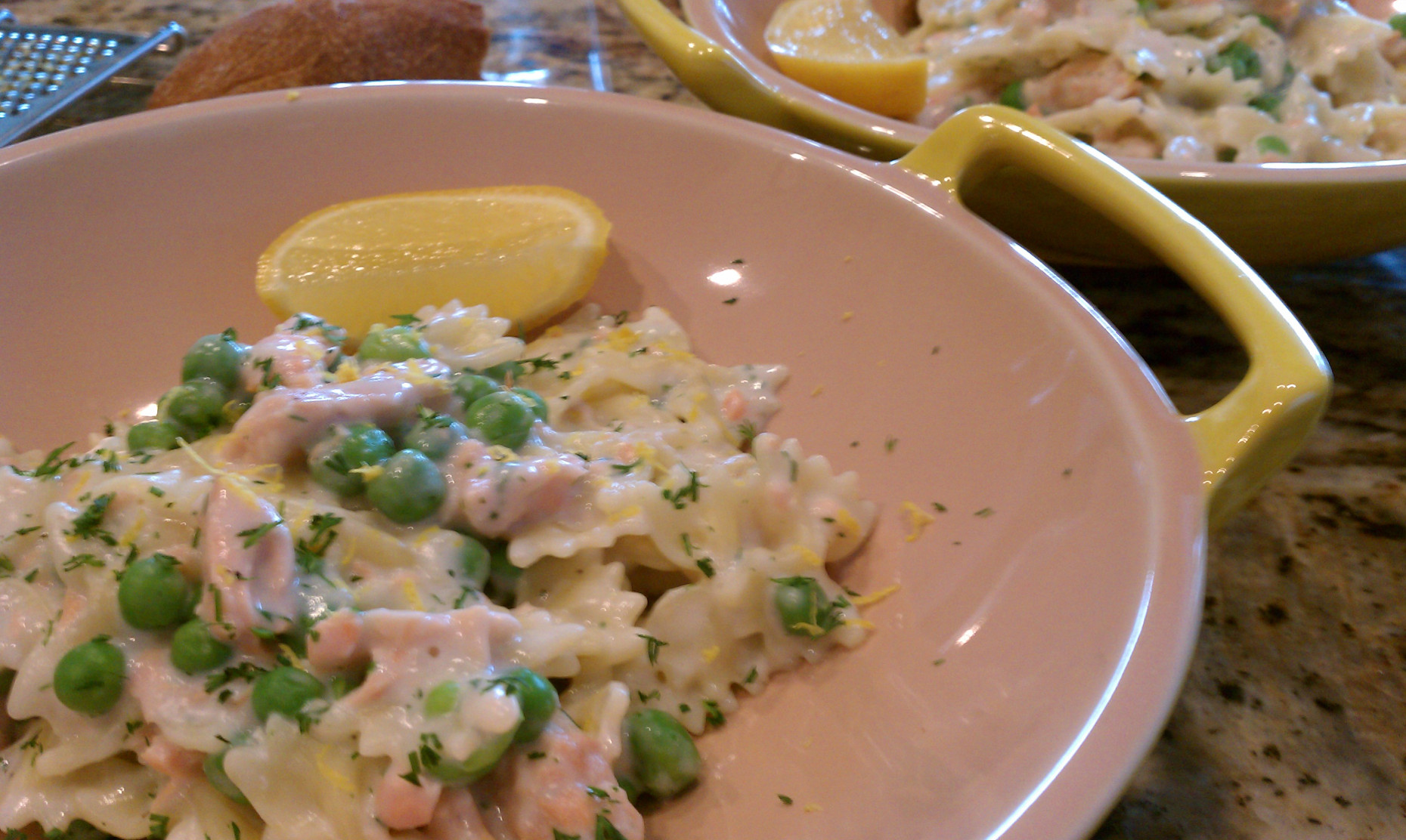 A plate of food with pasta and peas.