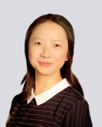 Smiling woman with black and white striped shirt.